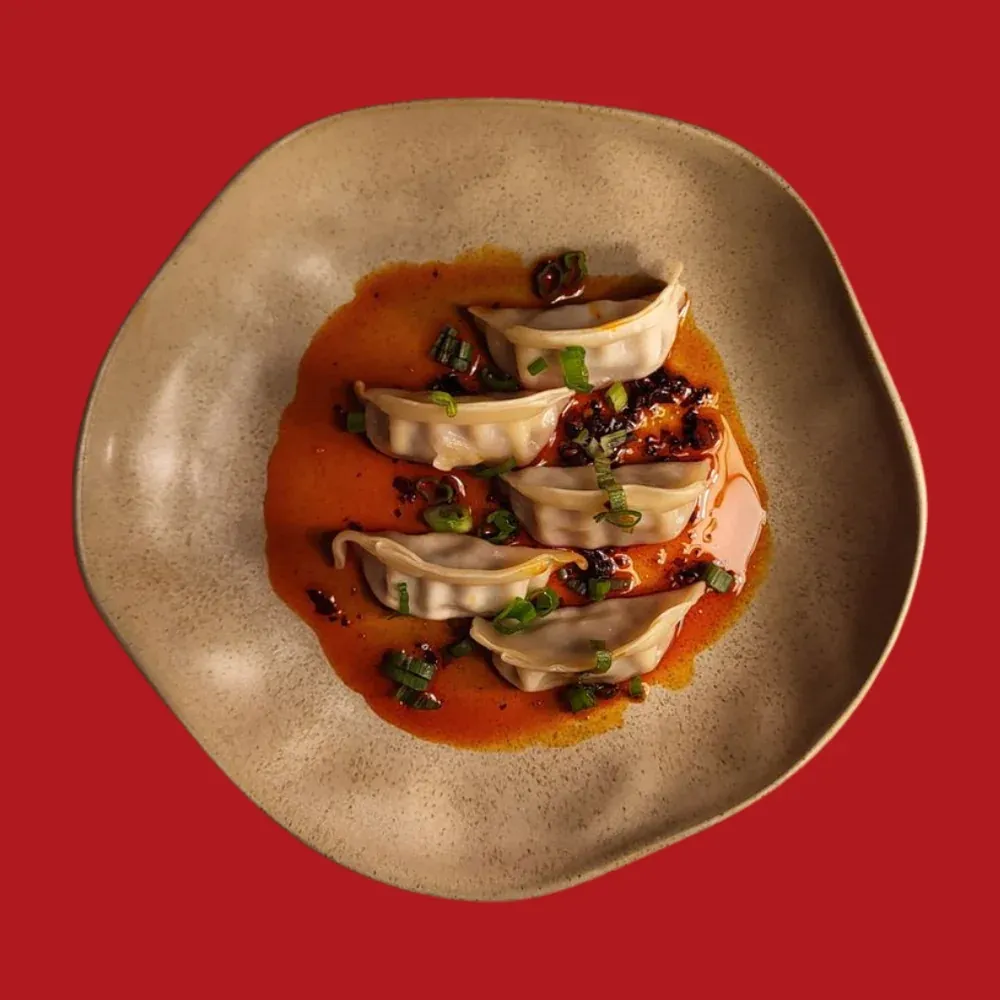 Pan-fried dumplings in chilli oil
